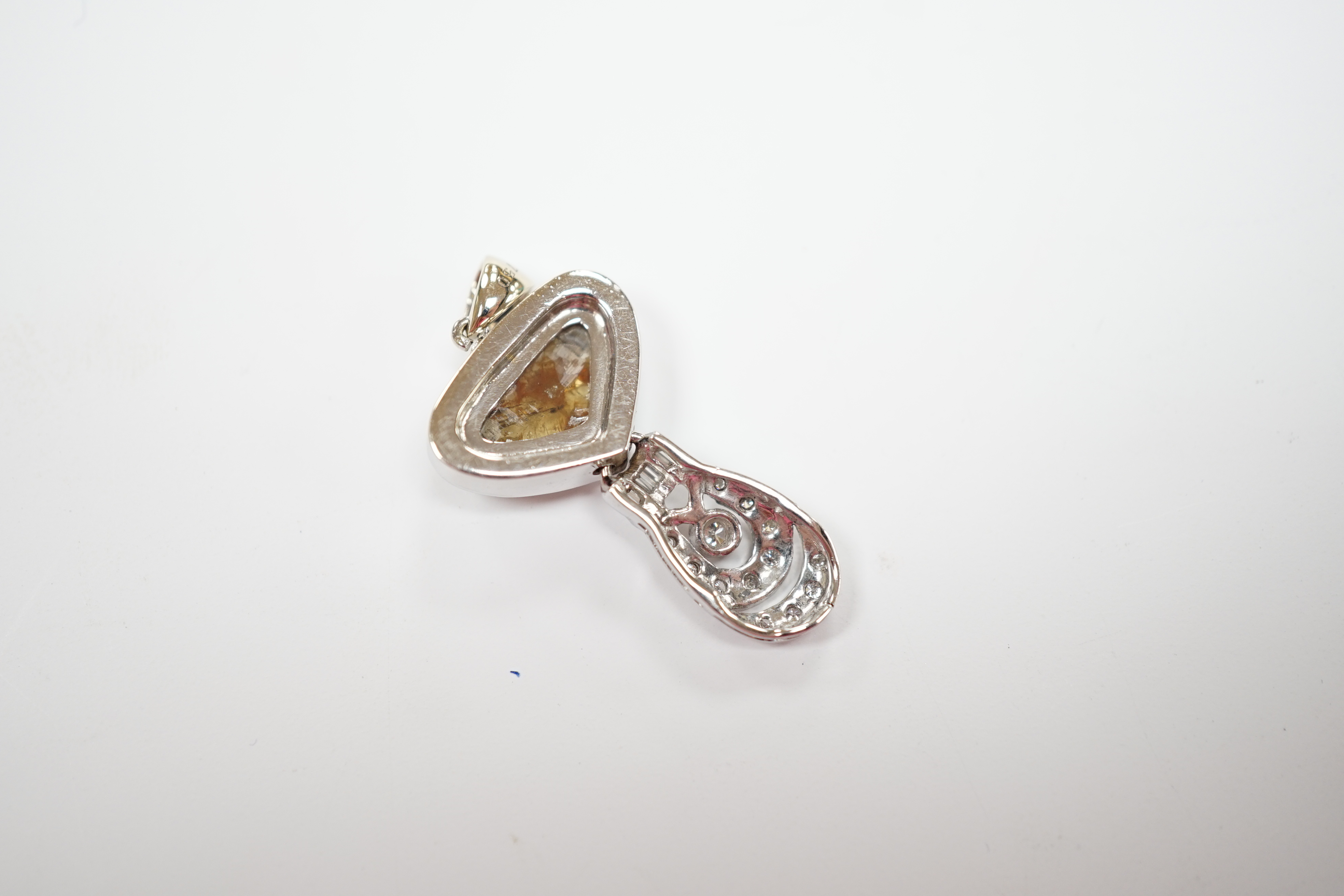 A 750 white metal and single stone fancy cut diamond set pendant, with diamond cluster set drop, overall 30mm, gross weight 5 grams.